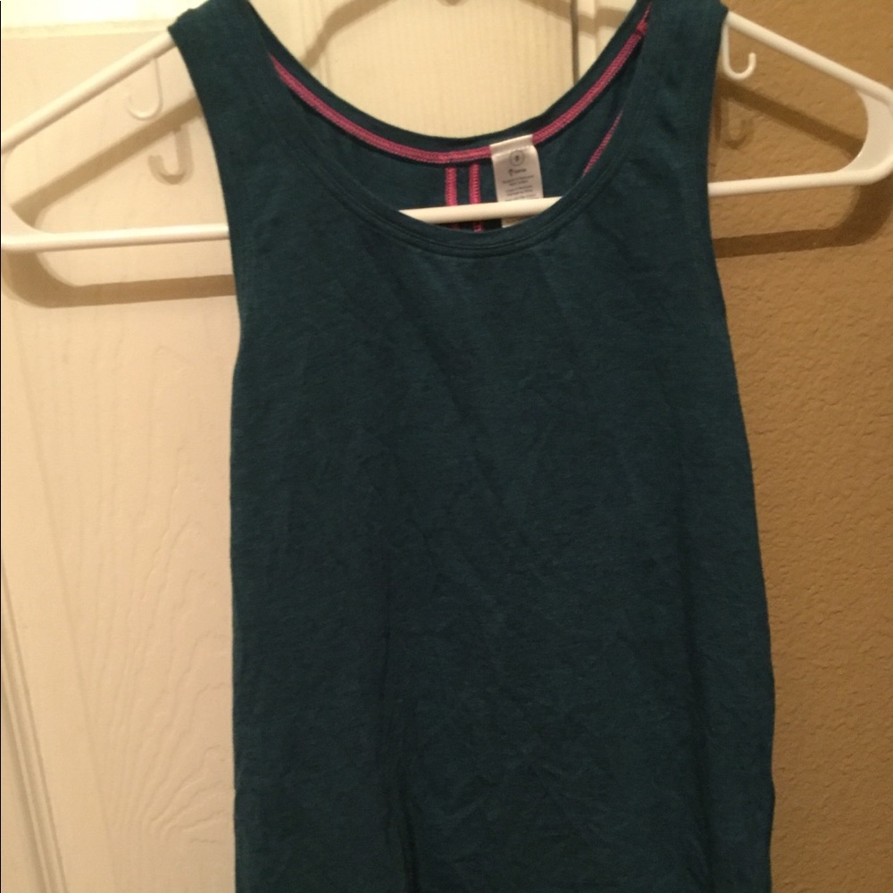 A dark blue Ivivva exercise shirt(worn once)